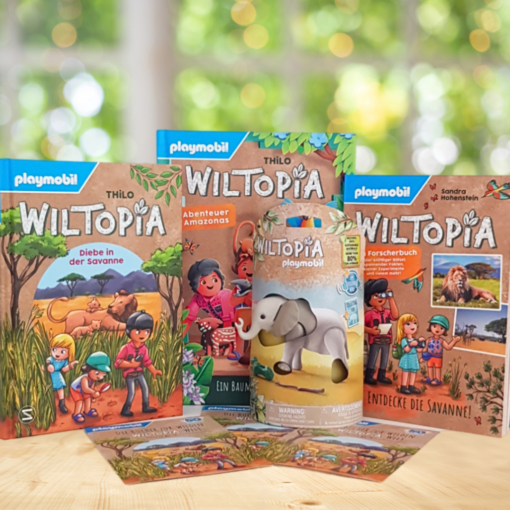 Drei PLAYMOBIL Wiltopia Bücher stehend und ein Elefant in seiner Verpackung